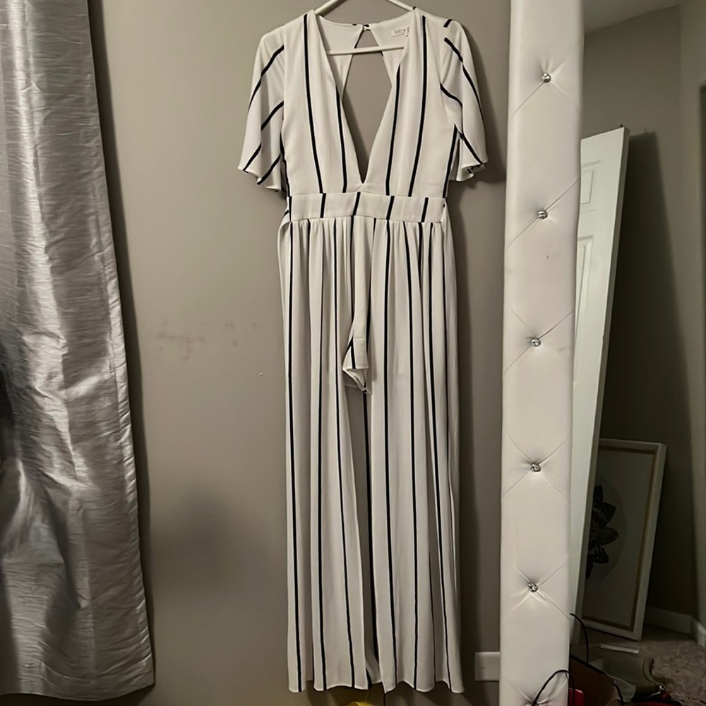 Shorts romper with open long skirt. Striped low cut V neckline